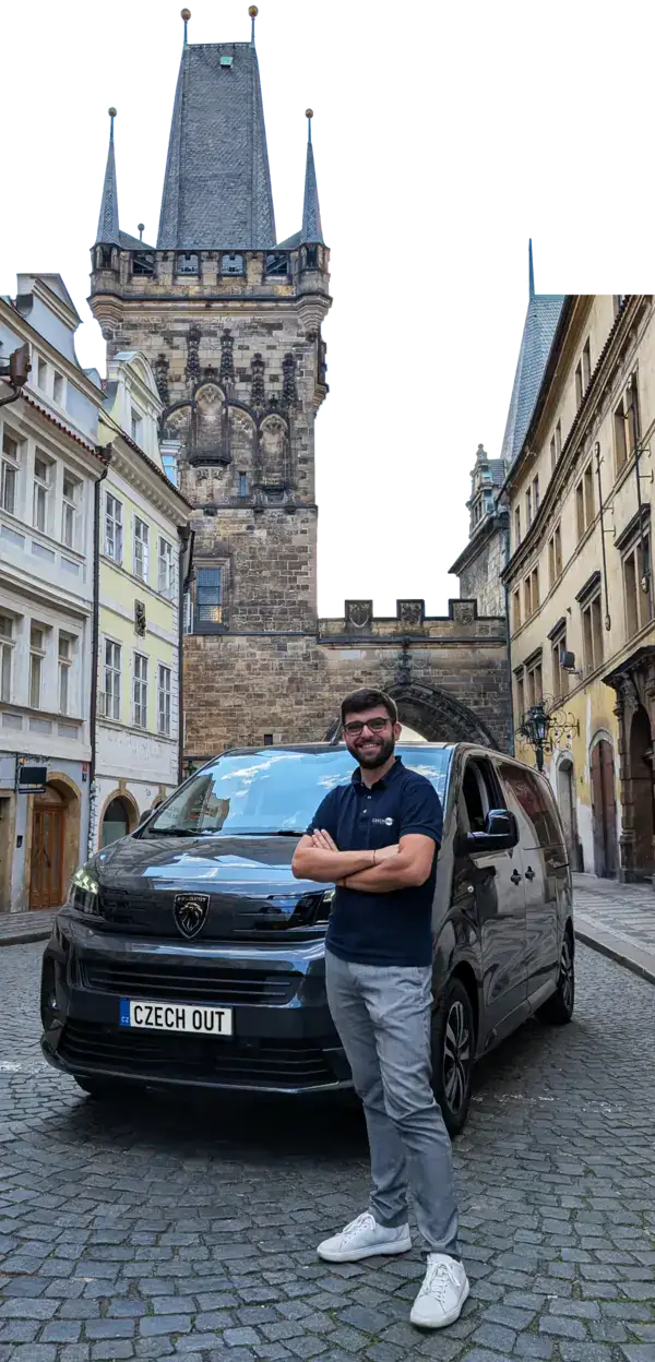 Local guide next to tour van in Prague's Old Town – Czech Out Tours offers small group day trips from Prague