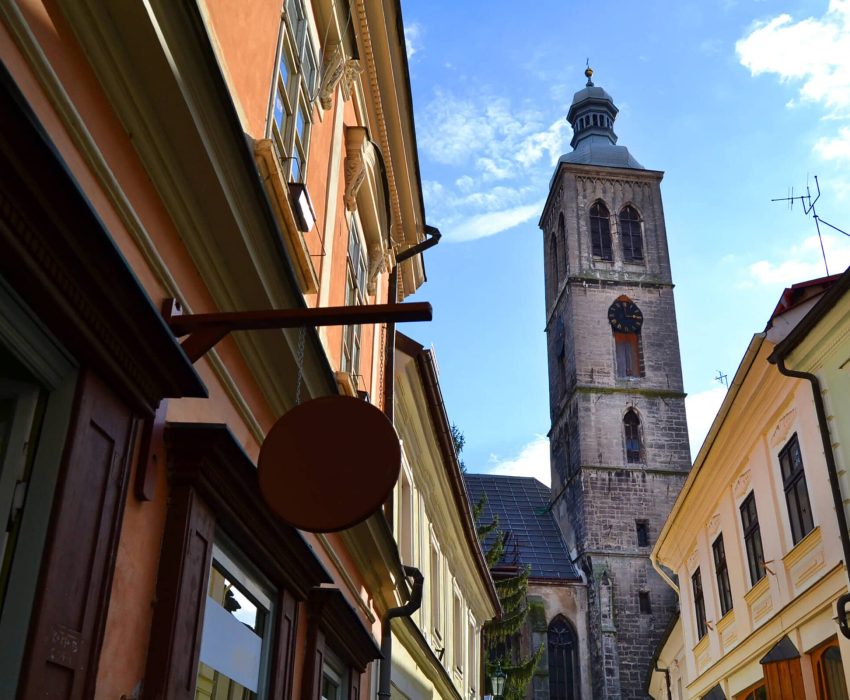Historic street and church tower in Kutná Hora