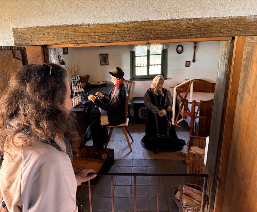 Visitors inside a reconstructed historical building